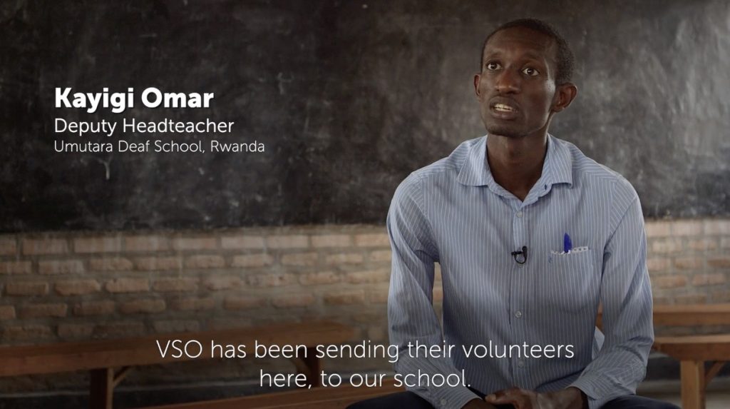 a man in a classroom being interviewed