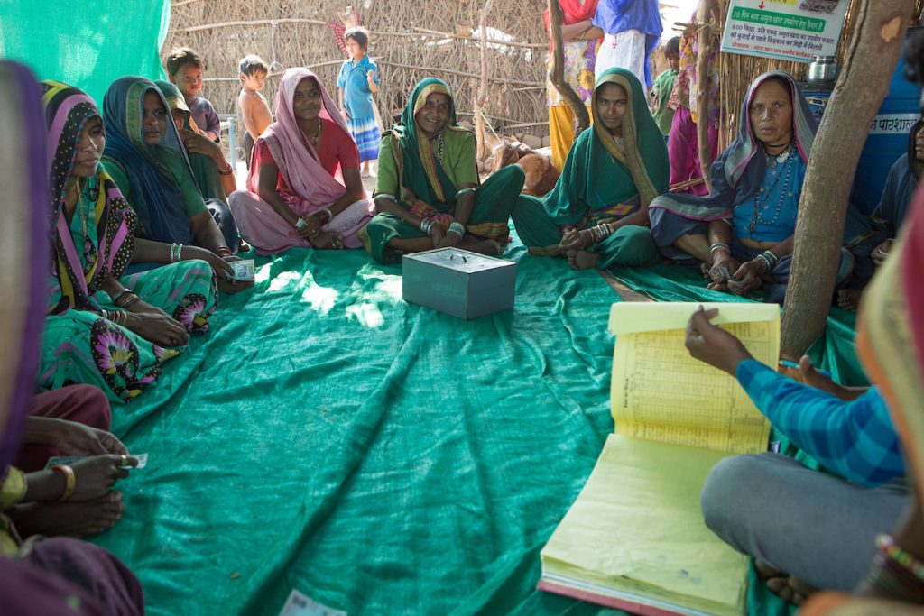 a group of female farmers in a meeting, India