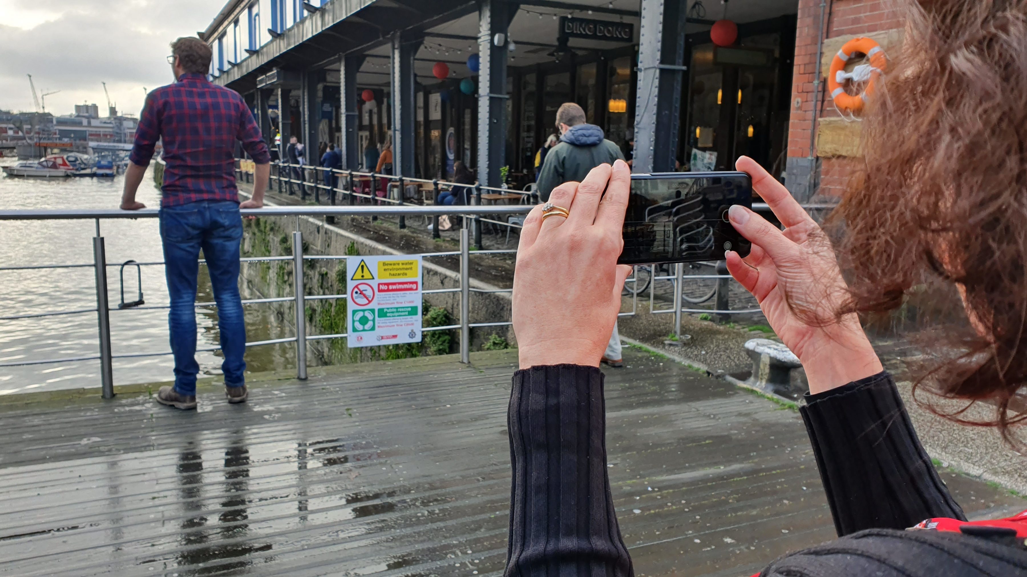 woman using a smartphone on a filmmaking course